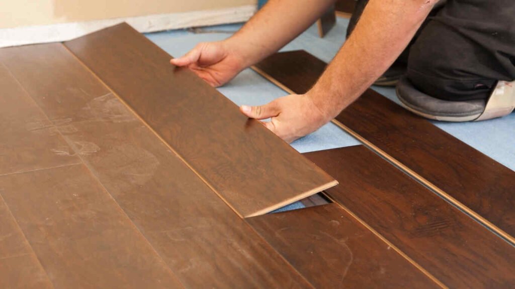 Specialists delivering wood flooring repair service for homeowners